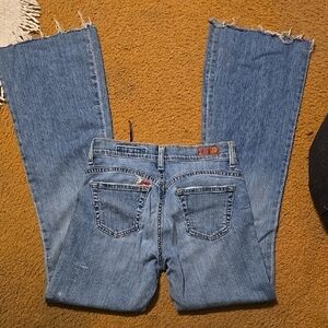 AG flare Jeans with Frayed Hems and Classic Denim Wash